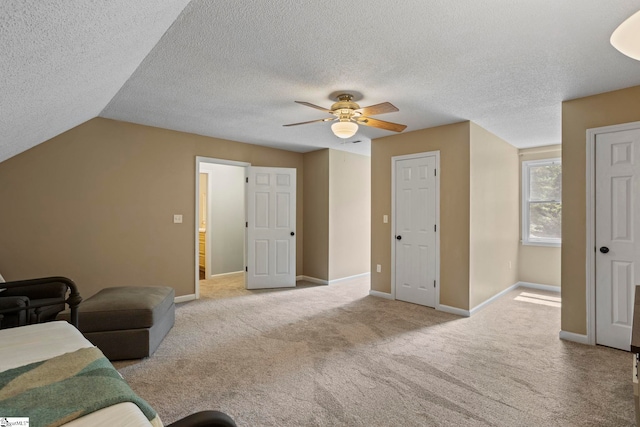 202 Shadow Oaks Dr, Easley, SC 29642 - living area featuring a ceiling fan, baseboards, carpet floors, a textured ceiling, and lofted ceiling