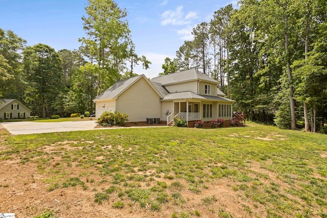202 Shadow Oaks Dr, Easley, SC 29642 - view of front of home with driveway, covered porch, a front lawn, a garage, and cooling unit