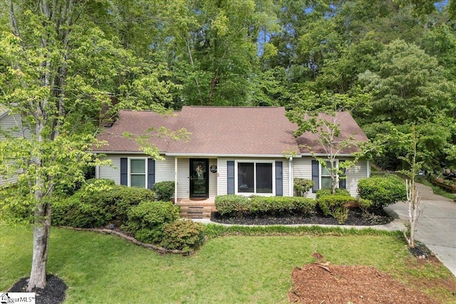 1606 Winding Way, Taylors, SC 29687 - view of front of home featuring a front yard, a chimney, and roof with shingles