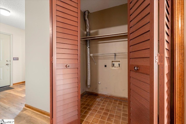1606 Winding Way, Taylors, SC 29687 - laundry room featuring electric dryer hookup, hookup for a washing machine, a textured ceiling, baseboards, and light wood-style flooring