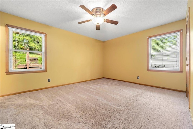 1606 Winding Way, Taylors, SC 29687 - empty room with light carpet, a ceiling fan, baseboards, and a textured ceiling