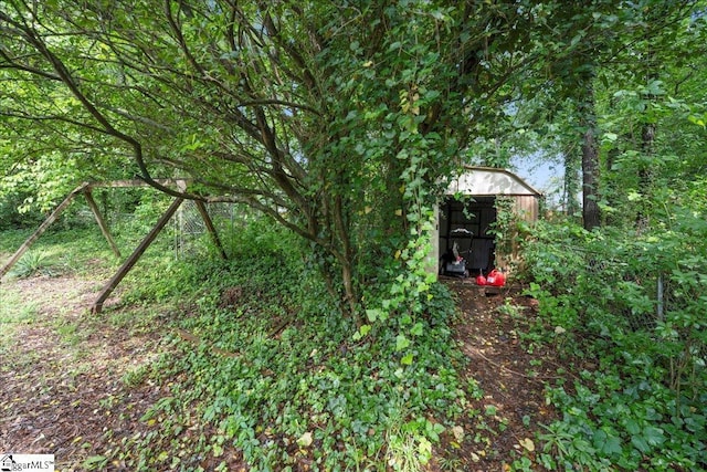 1606 Winding Way, Taylors, SC 29687 - view of yard featuring a storage shed and an outdoor structure