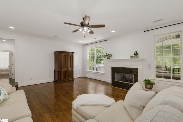 living room featuring ceiling fan, a fireplace, wood finished floors, baseboards, and recessed lighting