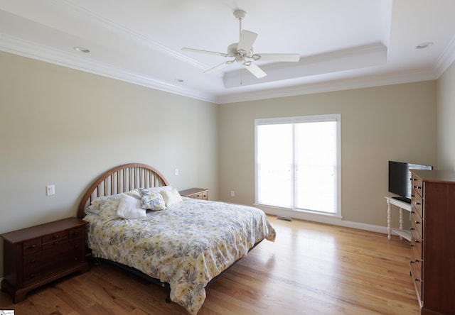 7 Collina Ct, Greenville, SC 29609 - bedroom featuring light wood-style floors, a raised ceiling, ornamental molding, and a ceiling fan