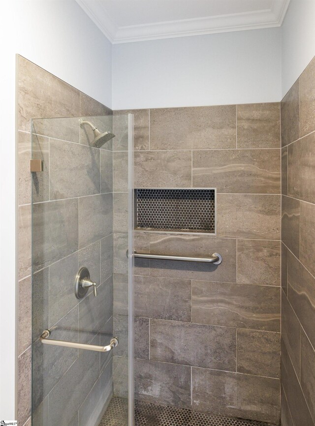 7 Collina Ct, Greenville, SC 29609 - bathroom featuring a shower stall and ornamental molding