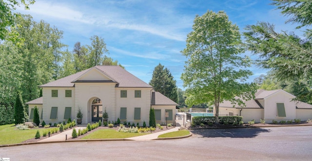 7 Collina Ct, Greenville, SC 29609 - french country style house with uncovered parking and stucco siding
