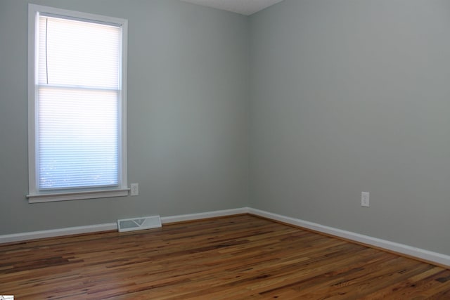 106 Saluda Rdg, Greenville, SC 29611 - unfurnished room with wood finished floors, baseboards, and plenty of natural light