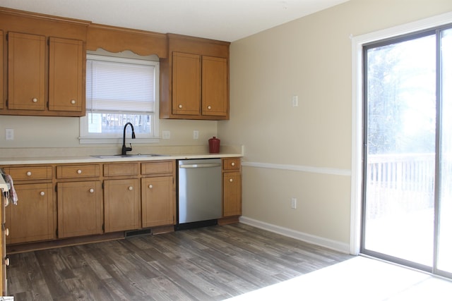 106 Saluda Rdg, Greenville, SC 29611 - kitchen with stainless steel dishwasher, a sink, dark wood-style flooring, and brown cabinets