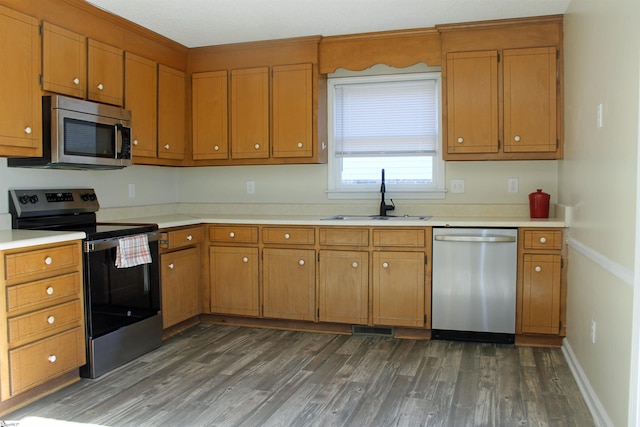 106 Saluda Rdg, Greenville, SC 29611 - kitchen with stainless steel appliances, a sink, dark wood-style floors, light countertops, and brown cabinets