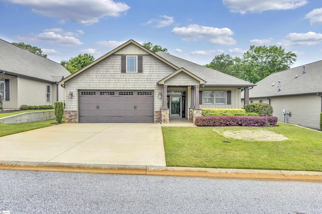 302 Owasso Dr, Greenville, SC 29615 - craftsman house with stone siding, concrete driveway, a front yard, and board and batten siding