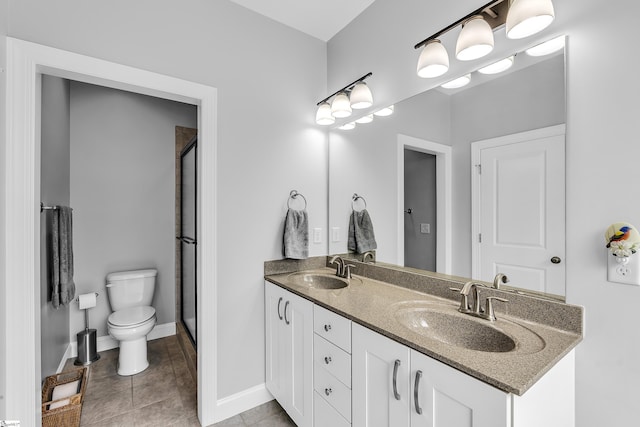 302 Owasso Dr, Greenville, SC 29615 - bathroom featuring toilet, double vanity, an enclosed shower, and tile patterned floors