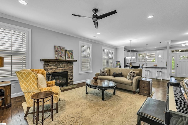 302 Owasso Dr, Greenville, SC 29615 - living area with ornamental molding, a ceiling fan, a fireplace, recessed lighting, and dark wood-style flooring