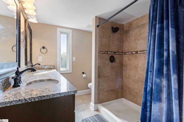 21 Pebble Creek Way, Taylors, SC 29687 - full bathroom featuring a shower stall, tile patterned flooring, toilet, double vanity, and baseboards