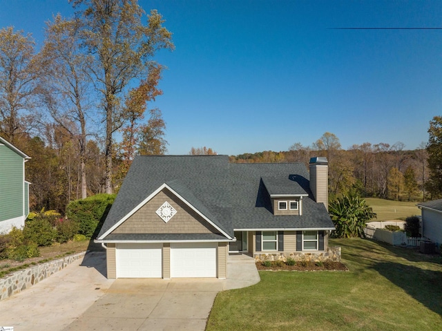 21 Pebble Creek Way, Taylors, SC 29687 - view of front of house featuring concrete driveway, a front yard, a chimney, a garage, and roof with shingles