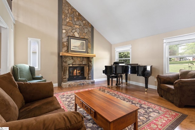 21 Pebble Creek Way, Taylors, SC 29687 - living area featuring a stone fireplace, high vaulted ceiling, wood finished floors, and baseboards