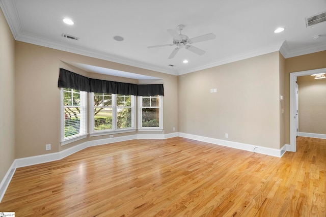 spare room with light wood-type flooring, ceiling fan, crown molding, baseboards, and recessed lighting