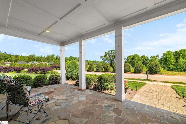 view of patio featuring view of scattered trees