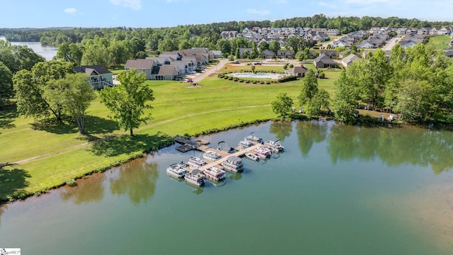 aerial view of residential area featuring a nearby body of water
