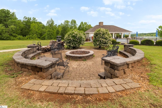 view of patio featuring an outdoor fire pit and a gazebo