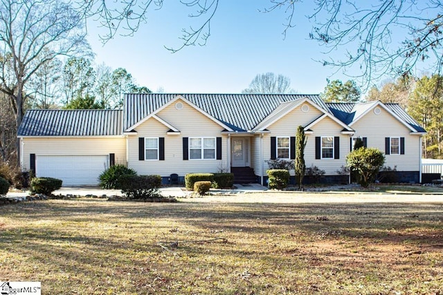 521 N Calhoun Shores Pkwy, Calhoun Falls, SC 29628 - view of front of home with a garage, metal roof, and a front lawn