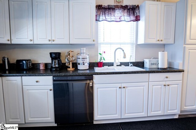 521 N Calhoun Shores Pkwy, Calhoun Falls, SC 29628 - kitchen featuring dishwasher, a sink, dark countertops, and white cabinetry