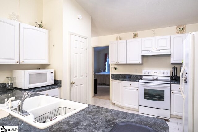 521 N Calhoun Shores Pkwy, Calhoun Falls, SC 29628 - kitchen featuring white appliances, a sink, white cabinets, and light tile patterned floors