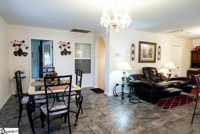 521 N Calhoun Shores Pkwy, Calhoun Falls, SC 29628 - dining space featuring arched walkways and baseboards