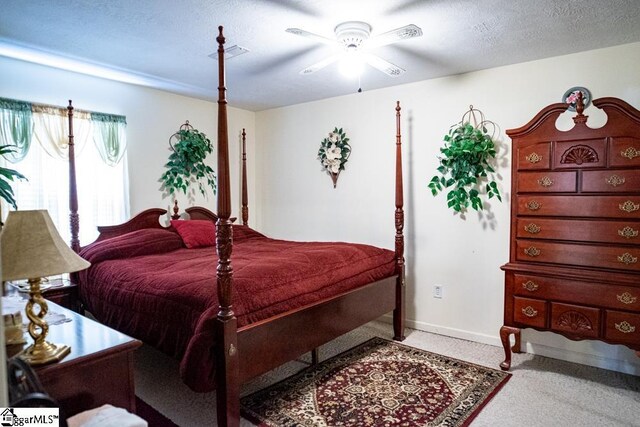 521 N Calhoun Shores Pkwy, Calhoun Falls, SC 29628 - carpeted bedroom featuring baseboards, a ceiling fan, and a textured ceiling