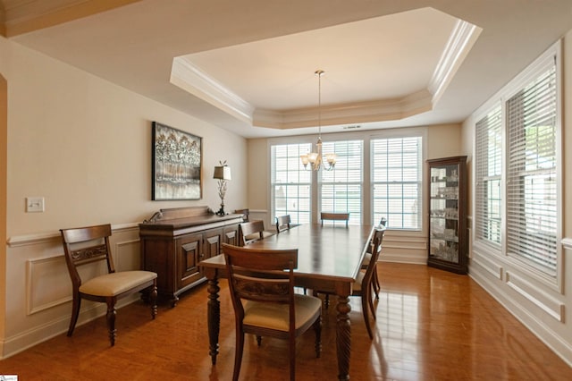 30 Kittery Dr, Greenville, SC 29615 - dining room with wood finished floors, a raised ceiling, crown molding, plenty of natural light, and a chandelier