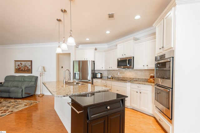 30 Kittery Dr, Greenville, SC 29615 - kitchen featuring appliances with stainless steel finishes, white cabinetry, a sink, tasteful backsplash, and crown molding