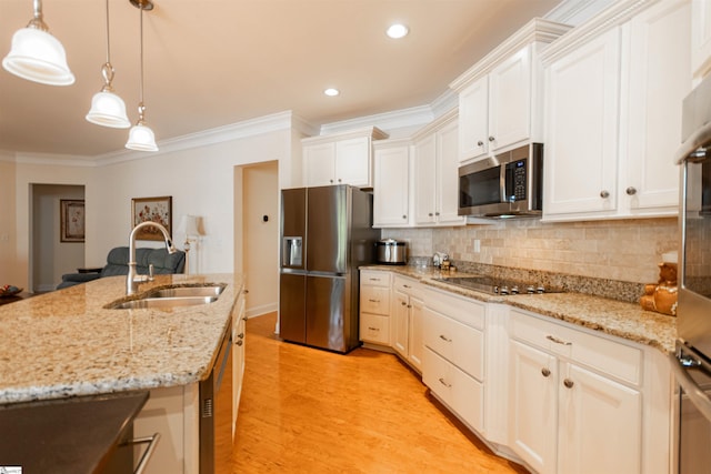30 Kittery Dr, Greenville, SC 29615 - kitchen with stainless steel appliances, a sink, crown molding, light wood-type flooring, and backsplash