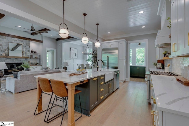205 Fairview Dr, Greenville, SC 29609 - kitchen featuring a sink, appliances with stainless steel finishes, ceiling fan, healthy amount of natural light, and crown molding