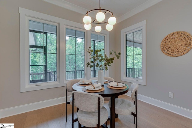 205 Fairview Dr, Greenville, SC 29609 - dining space with wood finished floors, baseboards, and a chandelier
