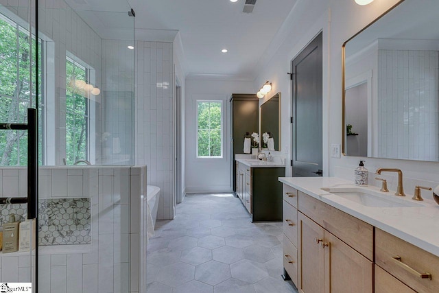 205 Fairview Dr, Greenville, SC 29609 - bathroom featuring tile patterned floors, crown molding, two vanities, and a soaking tub
