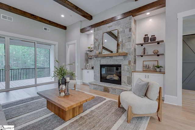 205 Fairview Dr, Greenville, SC 29609 - living room with light wood finished floors, beam ceiling, a fireplace, recessed lighting, and baseboards
