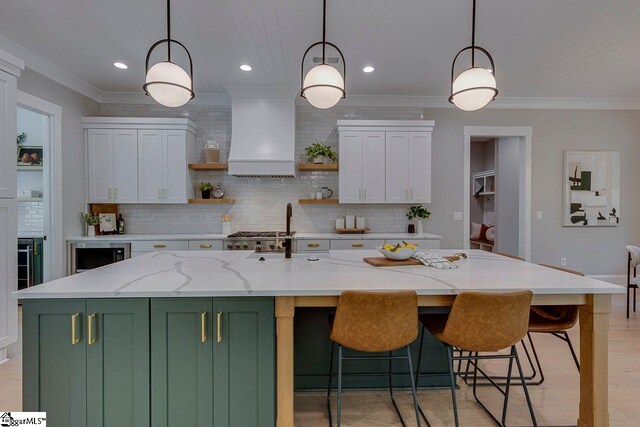 205 Fairview Dr, Greenville, SC 29609 - kitchen featuring green cabinets, premium range hood, open shelves, decorative backsplash, and white cabinets