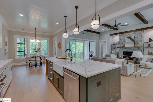 205 Fairview Dr, Greenville, SC 29609 - kitchen featuring dishwasher, a sink, a ceiling fan, light wood-style floors, and a fireplace