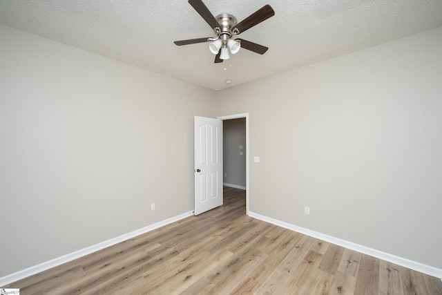 300 Stillwater Ct, Simpsonville, SC 29681 - unfurnished room with light wood-type flooring, baseboards, a ceiling fan, and a textured ceiling