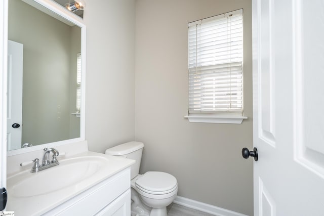 300 Stillwater Ct, Simpsonville, SC 29681 - half bathroom featuring plenty of natural light, toilet, vanity, and baseboards