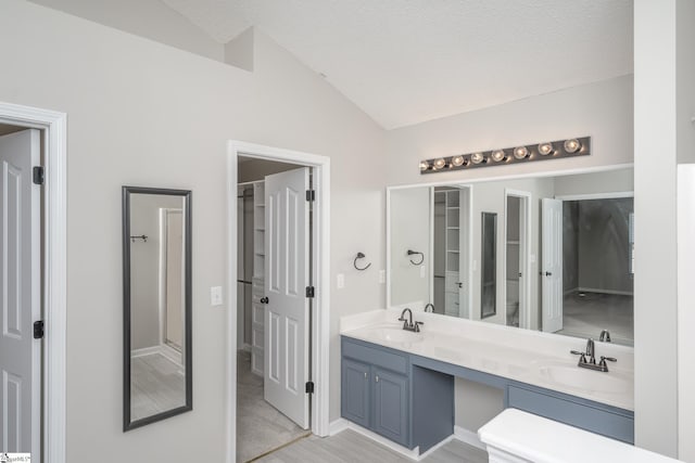 300 Stillwater Ct, Simpsonville, SC 29681 - full bath featuring vaulted ceiling, double vanity, toilet, a textured ceiling, and baseboards