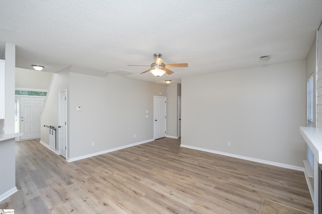 300 Stillwater Ct, Simpsonville, SC 29681 - empty room with a ceiling fan, light wood-type flooring, a textured ceiling, and baseboards