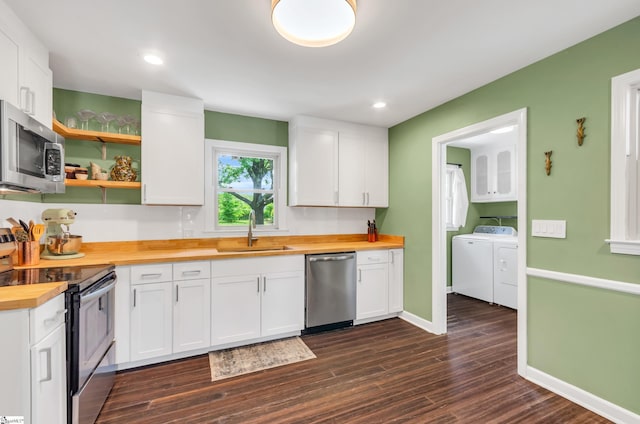 101 Kenilworth Ct, Greenville, SC 29615 - kitchen with appliances with stainless steel finishes, butcher block countertops, a sink, independent washer and dryer, and dark wood-style flooring