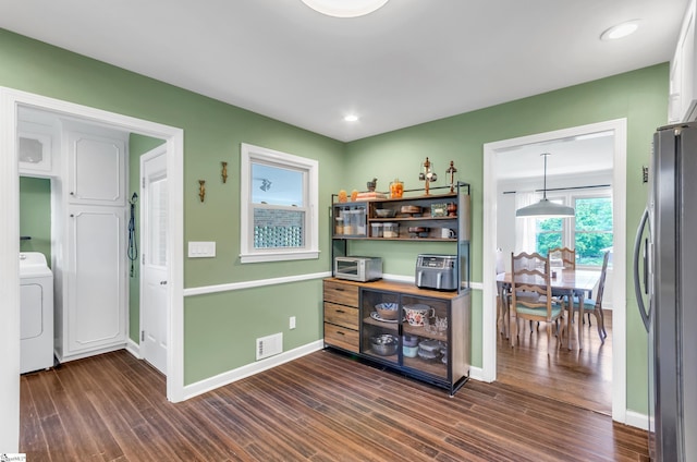 101 Kenilworth Ct, Greenville, SC 29615 - bar area featuring freestanding refrigerator, washer / dryer, dark wood-style floors, baseboards, and recessed lighting