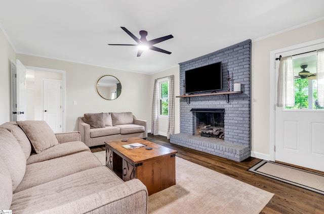 101 Kenilworth Ct, Greenville, SC 29615 - living room featuring a ceiling fan, wood finished floors, a brick fireplace, baseboards, and crown molding