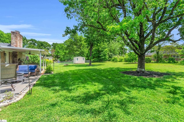 101 Kenilworth Ct, Greenville, SC 29615 - view of yard with a ceiling fan, a patio area, an outdoor structure, an outdoor living space, and a storage shed