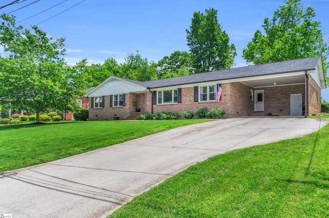 101 Kenilworth Ct, Greenville, SC 29615 - ranch-style home with brick siding, an attached carport, concrete driveway, a front lawn, and crawl space