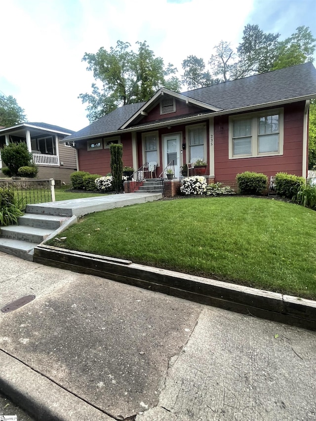 235 Brookwood Ter, Spartanburg, SC 29306 - view of front facade with a porch, a front yard, and a shingled roof