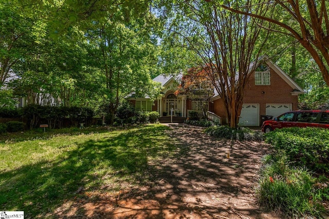 818 S Almond Dr, Simpsonville, SC 29681 - view of front of house featuring a garage and a front lawn