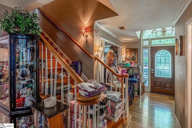 818 S Almond Dr, Simpsonville, SC 29681 - entryway with crown molding, hardwood / wood-style flooring, stairs, and a chandelier