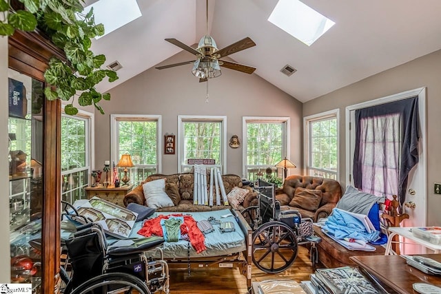 818 S Almond Dr, Simpsonville, SC 29681 - living room with a skylight, ceiling fan, wood finished floors, and high vaulted ceiling